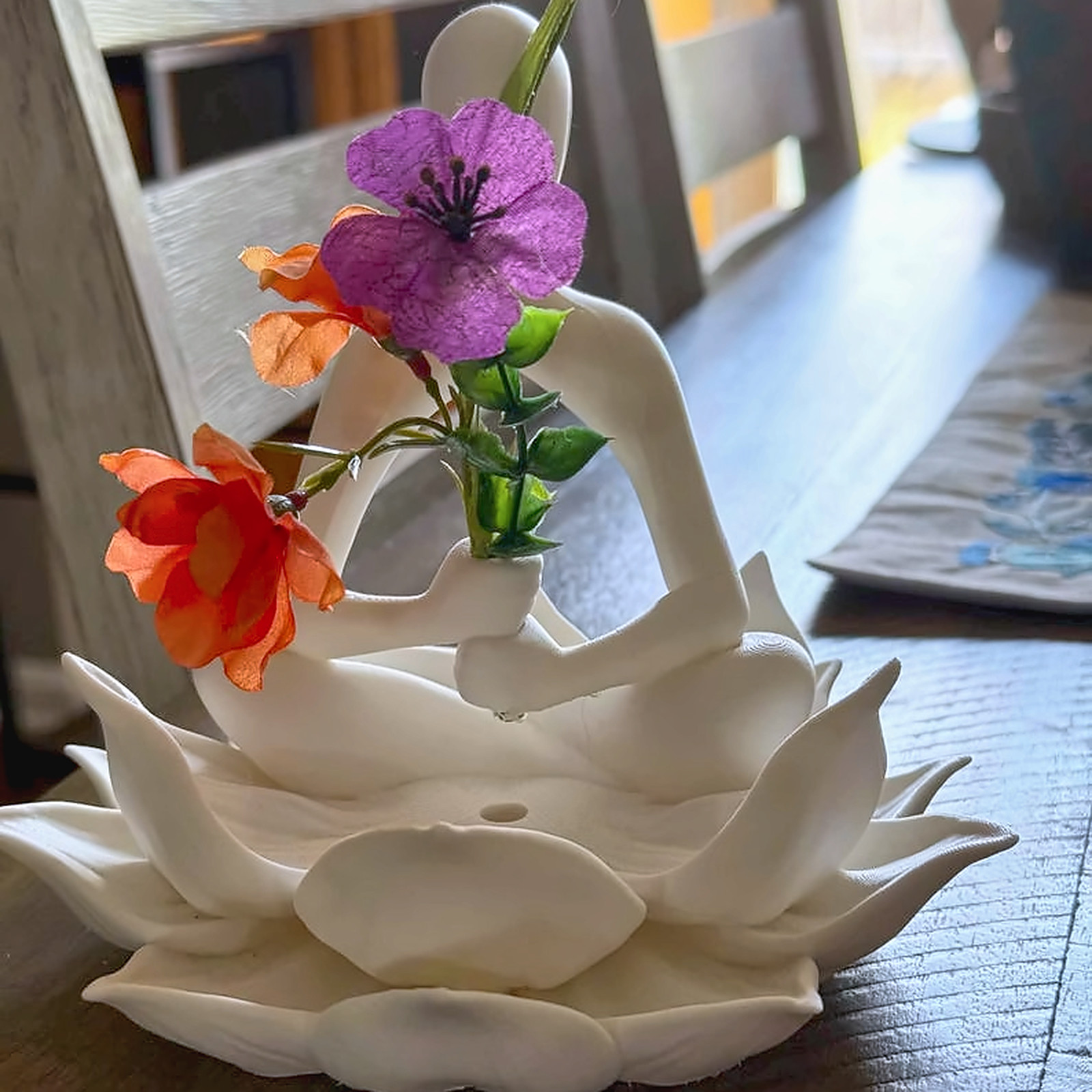 Side view of the white lotus keeper statuette.
